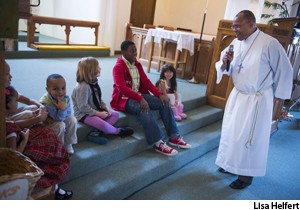 Ken Powell, vicar, visits with the children of Christ Lutheran, Catonsville, Md., a church undergoing redevelopment.