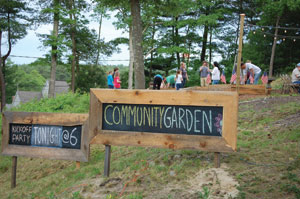 Simple chalkboards advertise special events, such as working in Sanctuary’s community garden that produces food for the local food pantry.