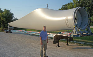 Jim Martin-Schramm stands by one of the blades for Luther College’s 1.6 megawatt GE wind turbine that he was instrumental in bringing to Decorah, Iowa.