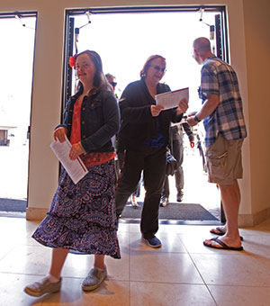 Dave Nagel Katelyn Reed enters Messiah Lutheran Church, Yorba Linda, Calif., for worship after being welcomed by Rick Eckart, a greeter and usher.