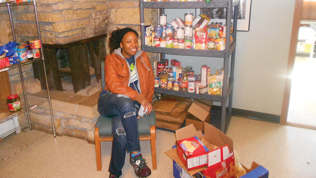 Student intern Ashley Crosby works at Crossroads Campus Ministry's Campus Cupboard, a food and toiletry pantry for students at the University of Minnesota-Mankato. "Being poor now as a college student isn't the same as it used to be," said Tammy Dahlvang, campus pastor.