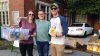 Ashley (left), Rob and Nick (last names withheld), students at the University of Tennessee in Knoxville, hand out snacks in front of Smokey's Pantry at Tyson House, the Lutheran-Episcopal campus ministry. "We're building a diverse, supportive community, and at the heart of that is upholding everyone's dignity," said John Tirro, campus pastor.