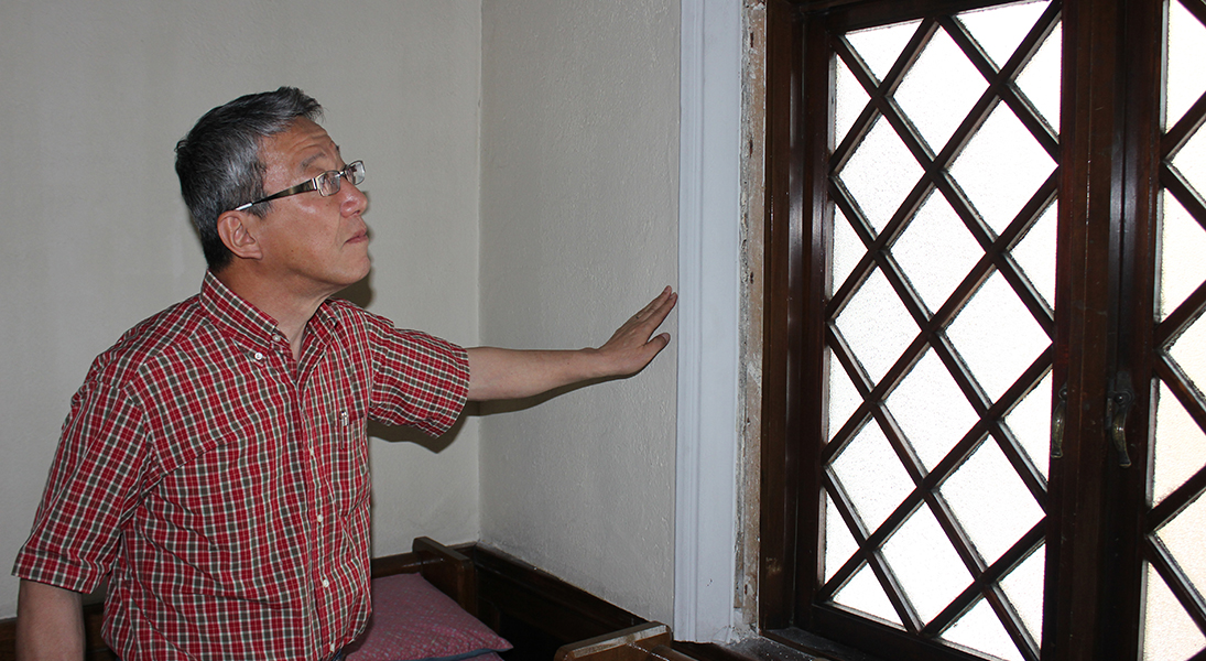 Pastor Yoichi Sugimoto shows some of the damage at Kumamoto Lutheran Church. While not immediately a dangerous situation, this damage can easily become worse.