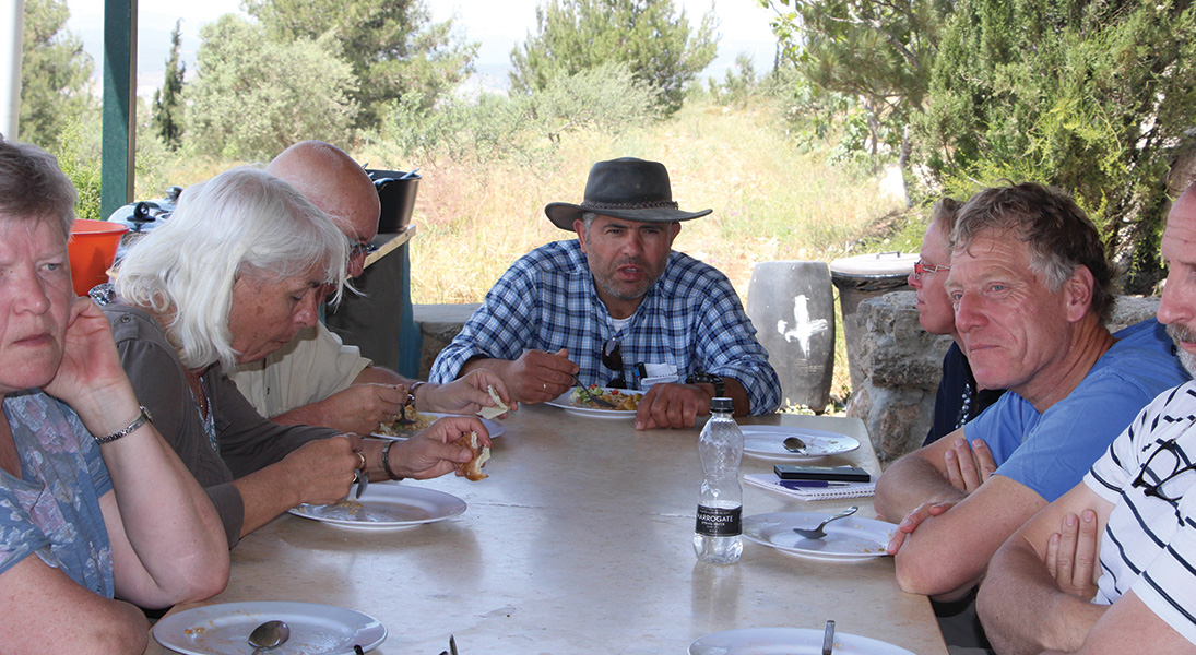 Nassar and Tent of Nations volunteers gather for lunch.