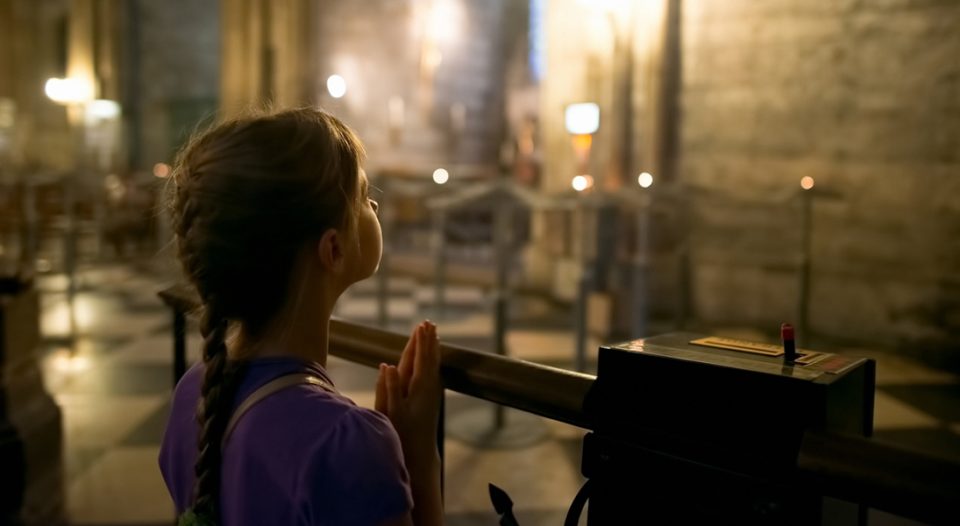 Girl praying at church