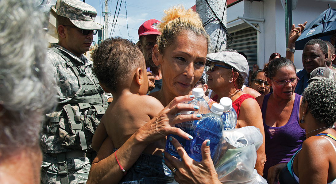 The National Guard delivers food and water to families in Barrio Obrero, San Juan, Puerto Rico, after Hurricane Maria.