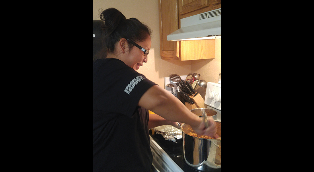 Rose Stanley, a Lutheran/Lakota Job Corps participant, prepares food at the Pine Ridge (S.D.) Retreat Center