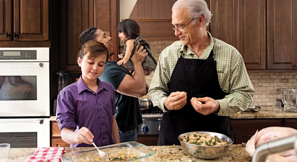 Blended Family preparing thanksgiving dinner together.