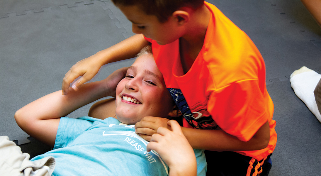 Two youth wrestle together
