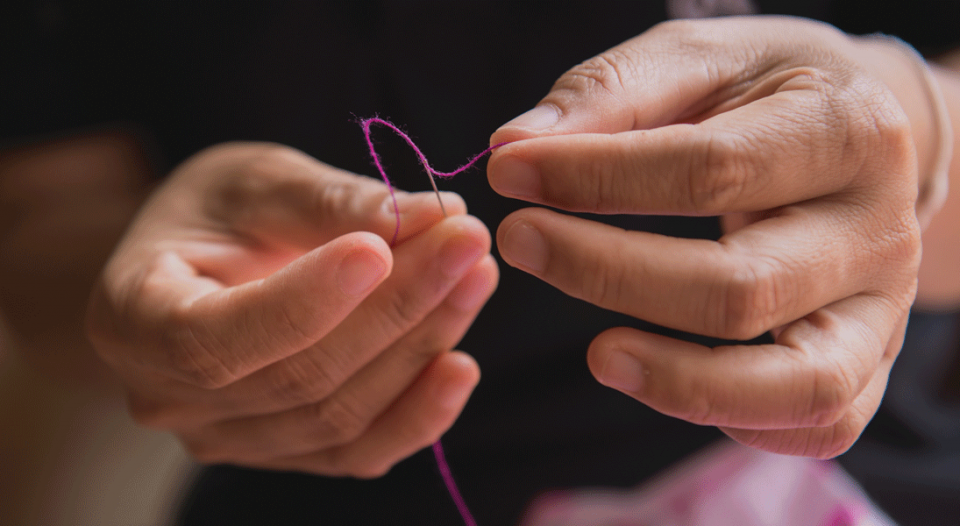 hands and thread