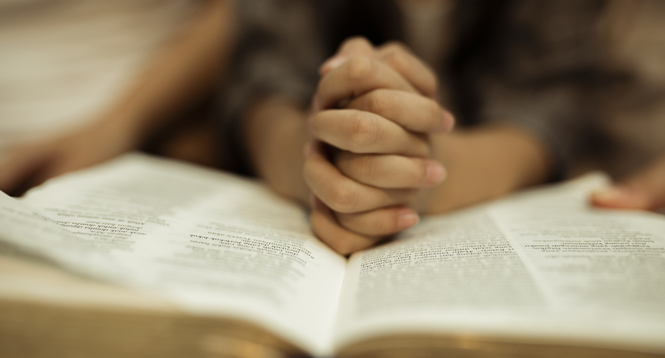 A child's hands in prayer