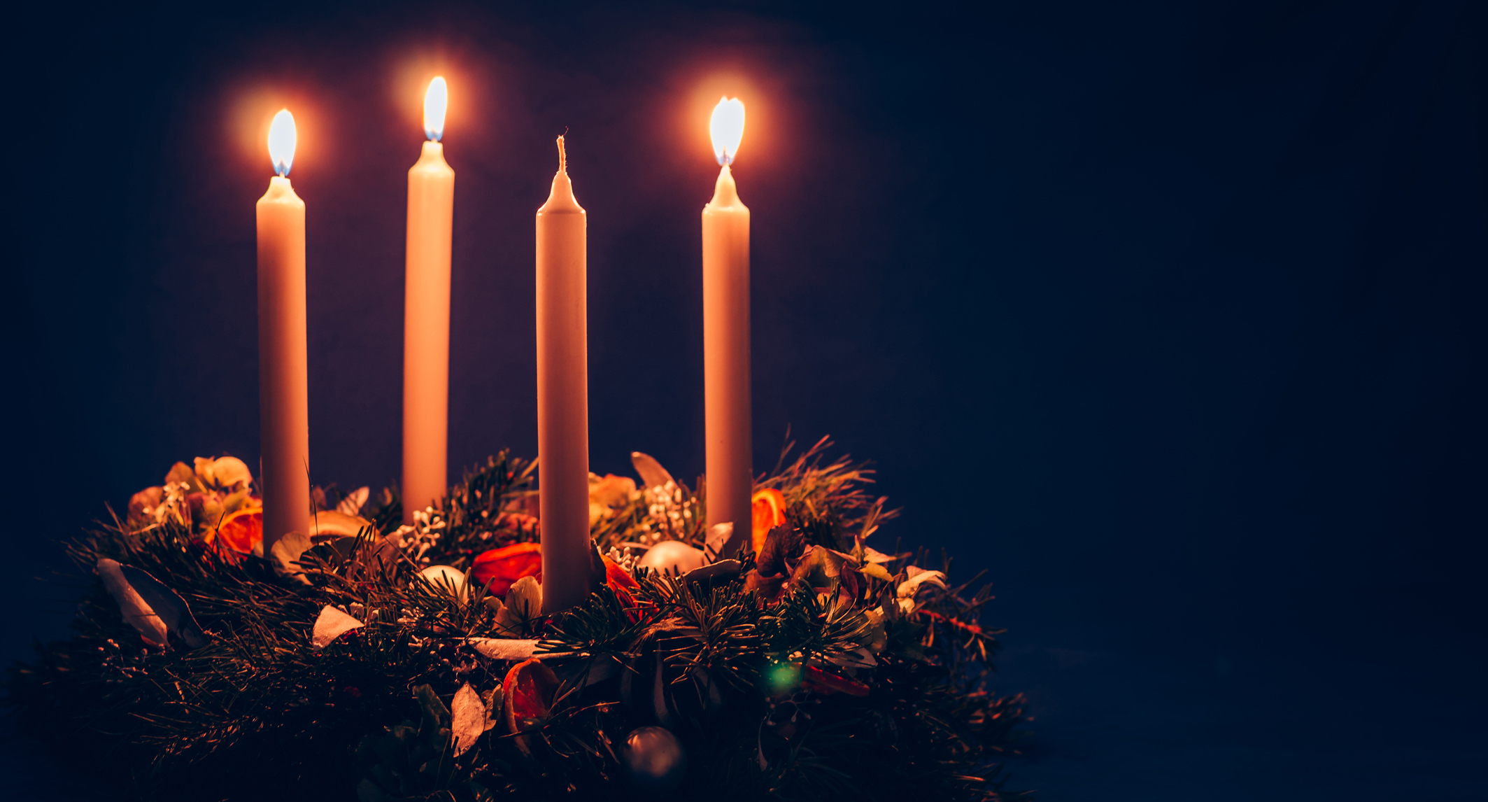Three candles lit on Advent wreath