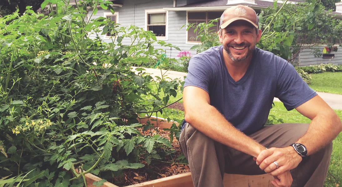 Jason A. Mahn in his garden