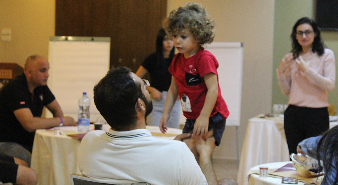 Pastor Ashraf Tannous cares for his child