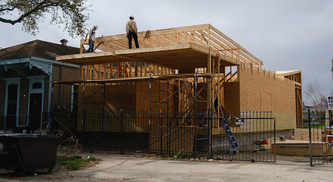 Students complete roof framing for the project.