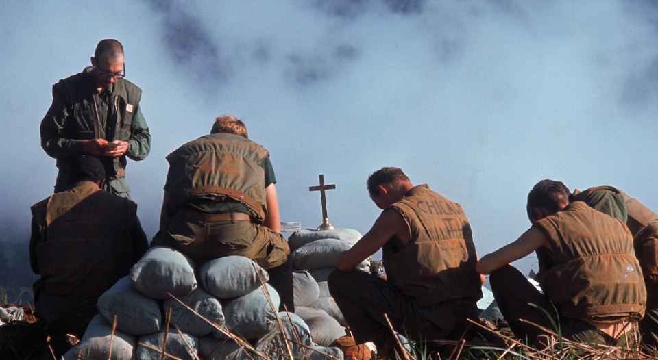 Ray Stubbe leads prayer as a Navy chaplain in 1968 during the Battle of Khe Sanh