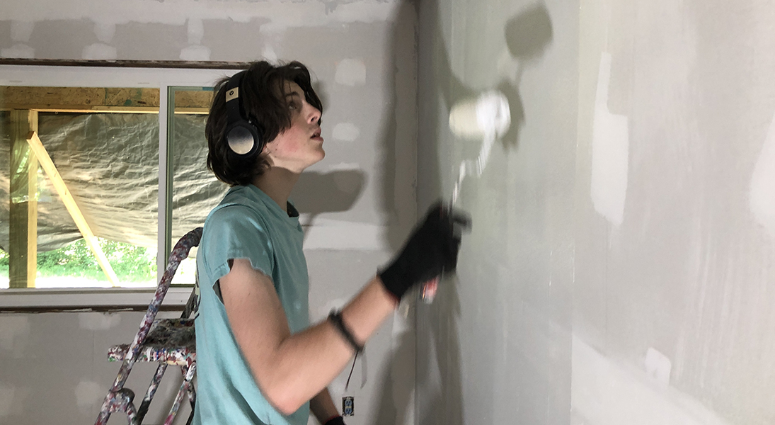 Gabe Graul does interior work on a Mayfield house