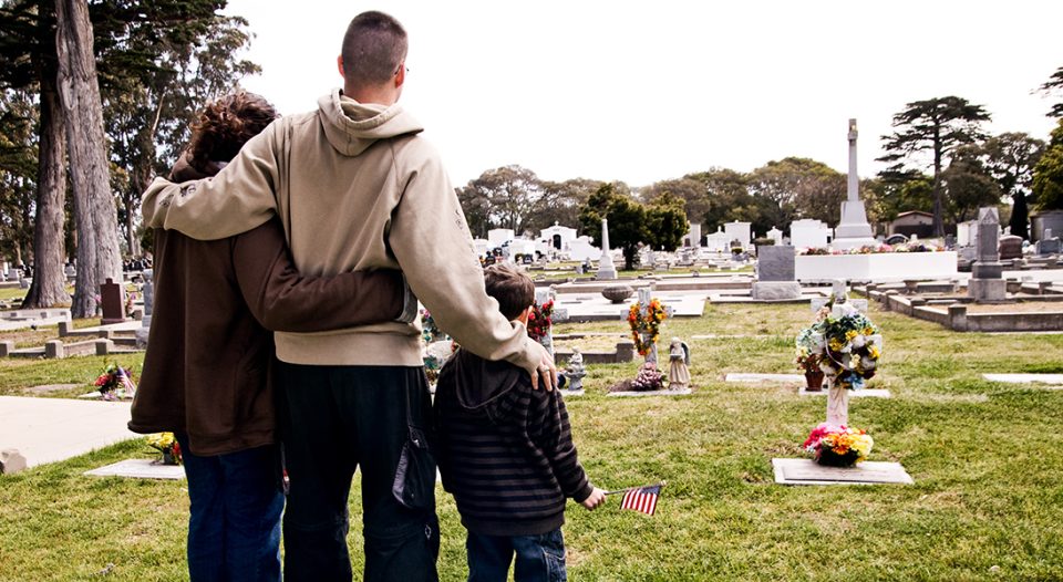Family visits a grave