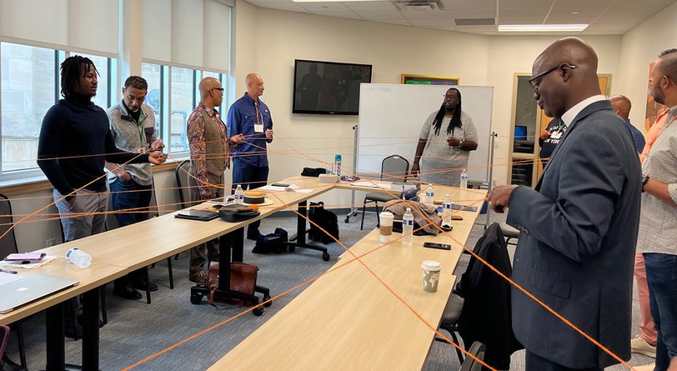 The gathering included preaching, worship, shared meals and workshops. In a workshop for Lutheran African Descent men in ministry, Pastor Jonathan Hemphill (center) led the group in an exercise illustrating the strength of a connected network.