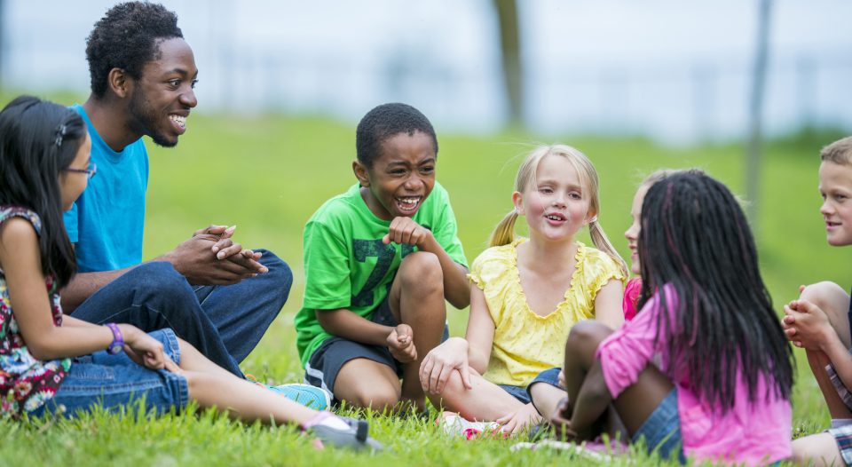 Kids and counselor at a summer camp.