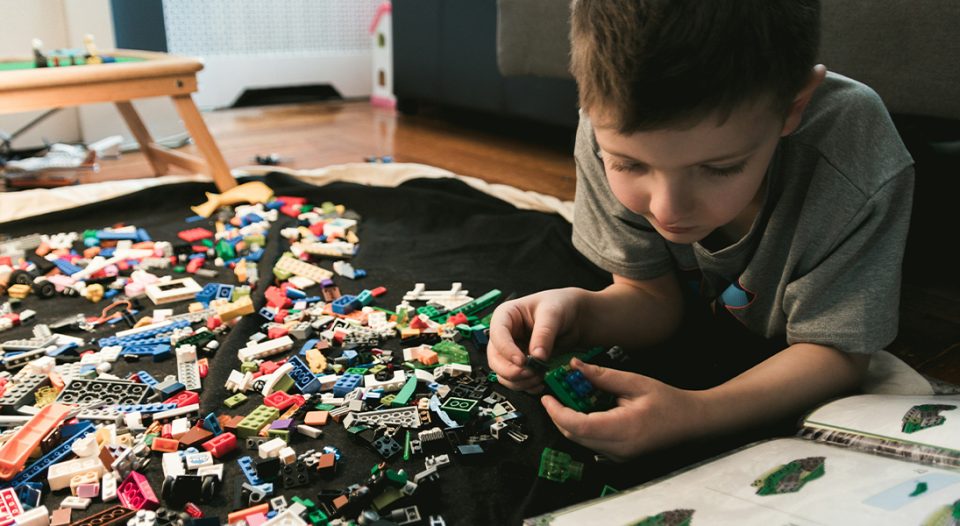 Child playing with Legos