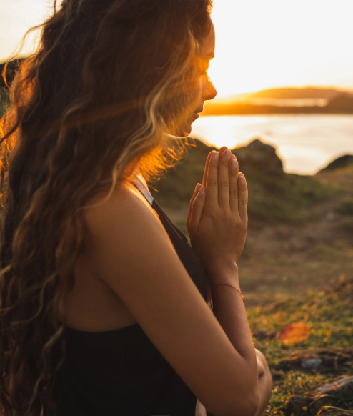 Girl praying in nature