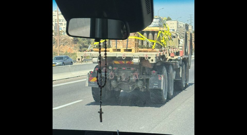 Israeli truck loaded with rockets with rosary hanging