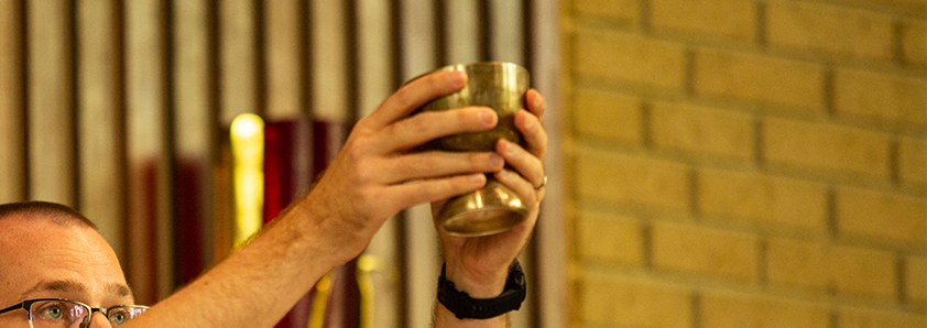 Man raising gold cup