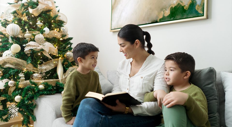 Family reading the Bible at Christmastime