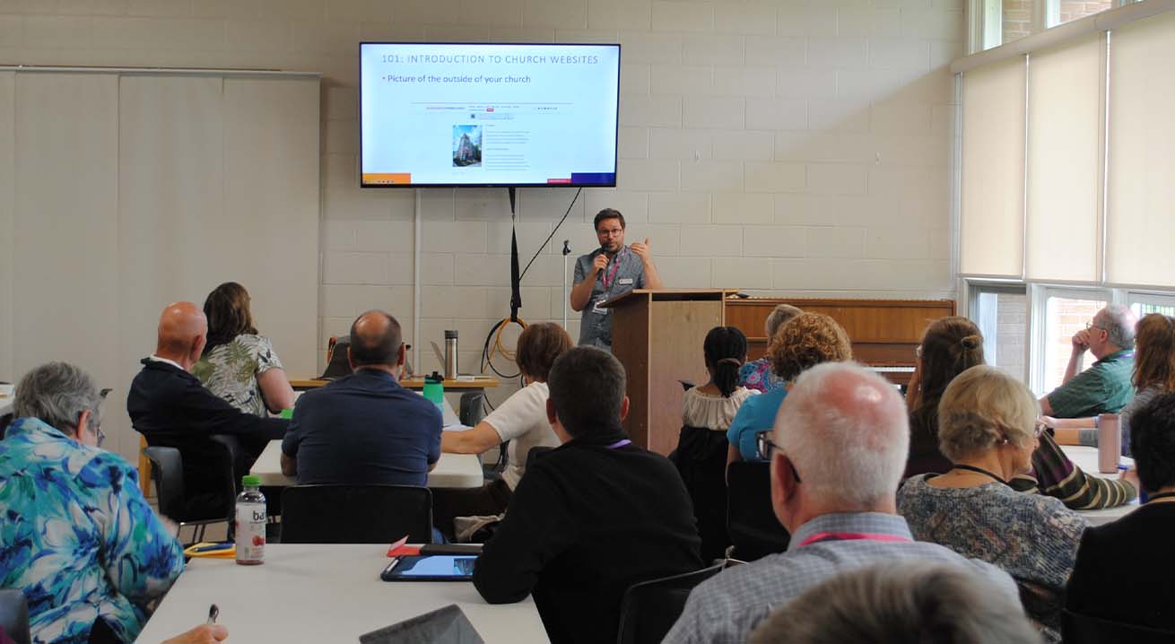 Alex Aivars, director of technology for the North/West Lower Michigan Synod, presents a workshop at his synod assembly. When his congregation helped him discern a call to ministry, synod and churchwide organization grants helped him offset the costs of seminary.
