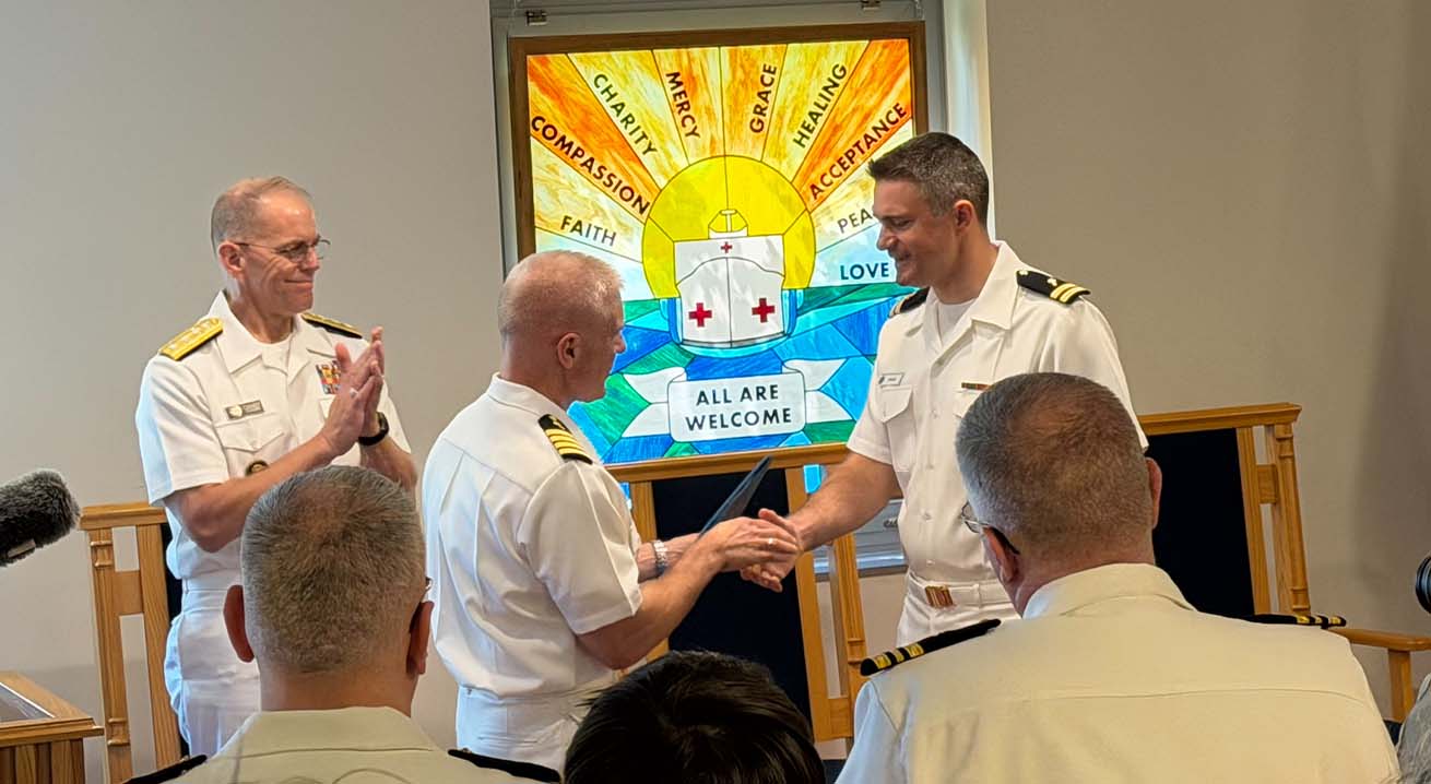 Chaplain William Bevin receives award